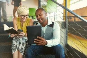 Man and woman discussing hashtag marketing strategies